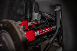 Chevrolet Camaro Control Arm - Rear - UMI Performance - Adjustable, Rod Ends - Red - `16-`24